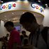 Visitors use their smartphones in front of a booth for Google 1 70x70 - PeopleStrong Buys Referral Hiring Platform Grownout