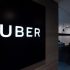 Uber signage is seen as an employee sits in the entrance of the ride hailing giants office in Hong Kong 1 70x70 - US Tells India to Cut Tariffs as Trade Friction Heats up