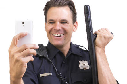 shutterstock police selfie - US prison telco accused of selling your phone’s location to the cops